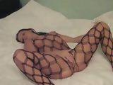 Amateur Girl In Fishnet Masturbates Her Wet Pussy
