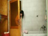 Latina Tera Joy showers in nylon pantyhose