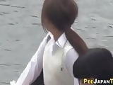 Pissing japanese teenagers get watched