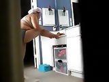 Asian Wife in Bathroom Putting Lotion on After Shower