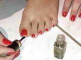 Doris put new and fresh nail polish on sexy toes